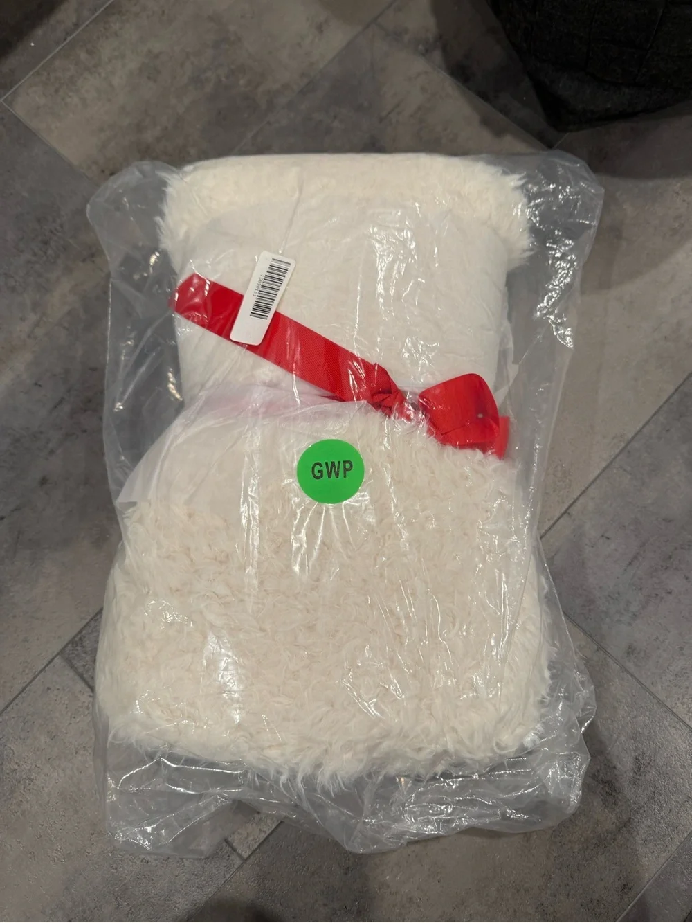 Express Ivory Faux Fur Throw with Red Ribbon Accent